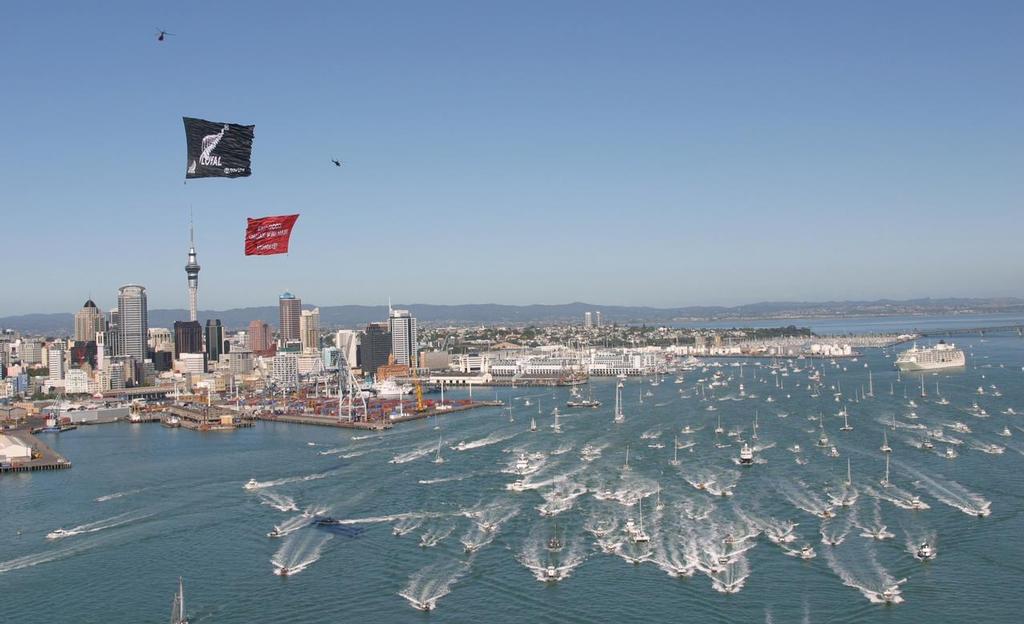 Team New Zealand leads a fleet of support boats out to the Hauraki Gulf from downtown Auckland. 2003 America's Cup © Kaoru Soehata